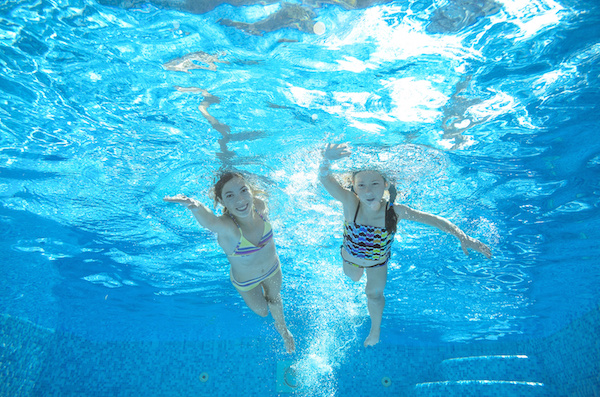 girls swimming in water